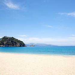 On the beach, sun loungers, beach umbrellas, beach towels
