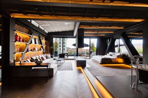 A modern interior with a sofa, a coffee table, and a bookshelf. - Cityloft 81 (Istanbul)