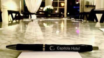 A pen on a hotel receipt with the Capitola Hotel name, indicating a booking or receipt from the hotel.