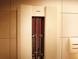 A wooden door with a mesh design and the brand name "KLAFS" above it. - Boutique Suites and Residences Heidelberg – Alte Zigarrenmanufaktur (Heidelberg)