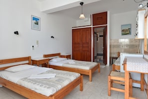 Triple Room | Minibar, iron/ironing board, WiFi, bed sheets