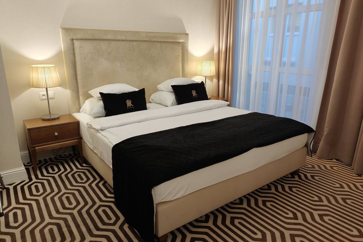 superior double or twin room | minibar, in-room safe, desk, iron/ironing board