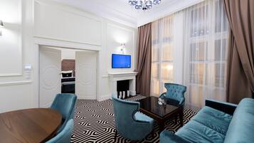 Apartment, 1 Bedroom | Minibar, in-room safe, desk, iron/ironing board