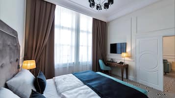 Apartment, 1 Bedroom | Minibar, in-room safe, desk, iron/ironing board