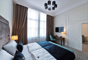 Apartment, 1 Bedroom | Minibar, in-room safe, desk, iron/ironing board