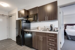 Suite, 1 King Bed, Non Smoking (One-Bedroom) | Private kitchen | Fridge, microwave, coffee/tea maker - Ramada by Wyndham Grassland (Grassland)