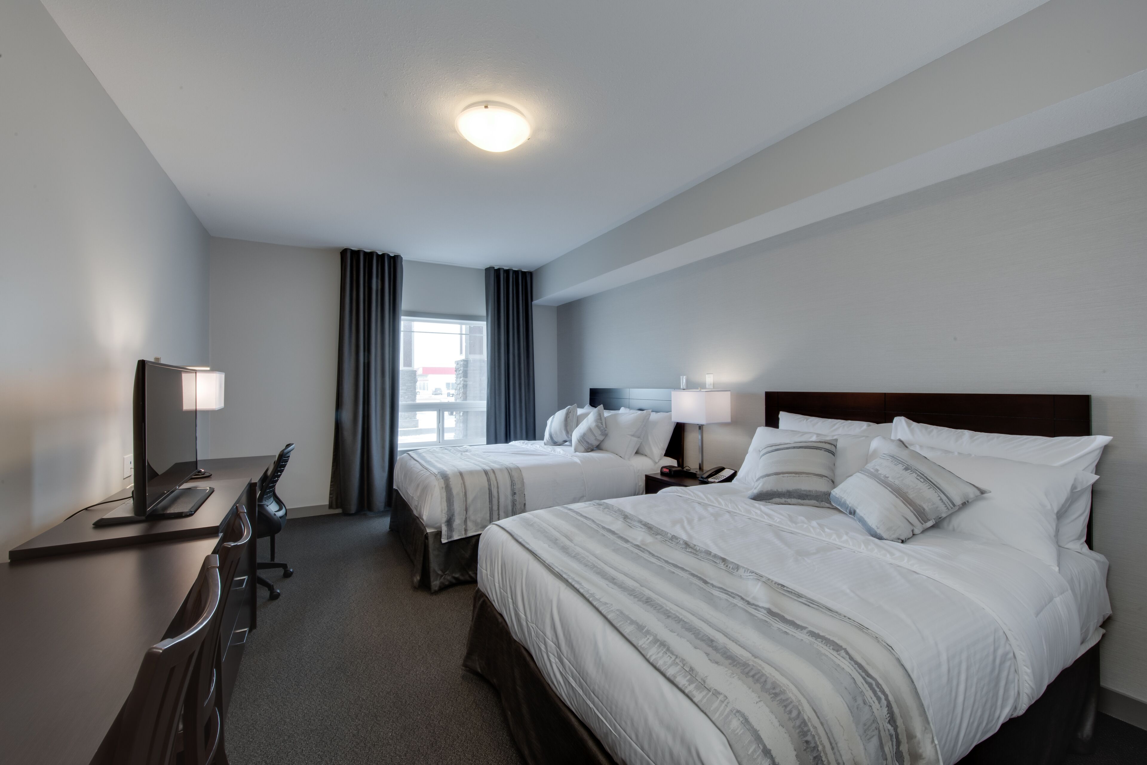 room, 2 queen beds, non smoking | in-room safe, desk, laptop workspace, blackout curtains