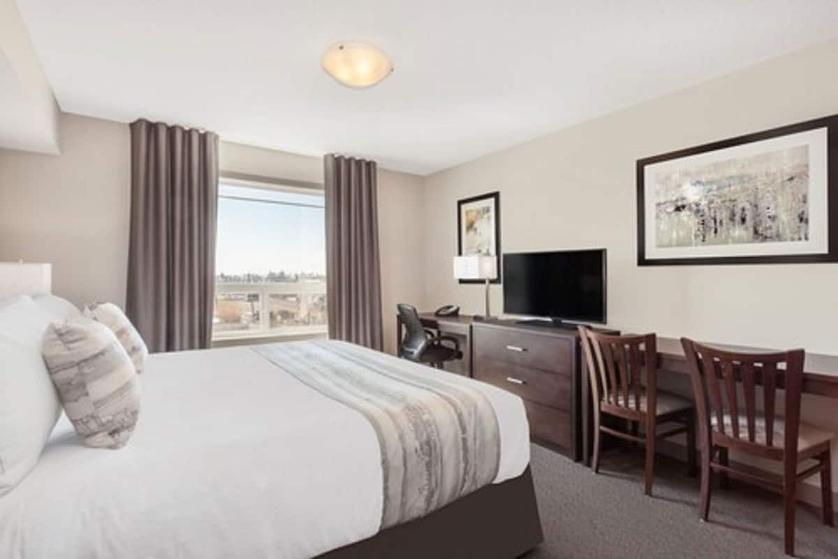 In-room safe, desk, laptop workspace, blackout curtains