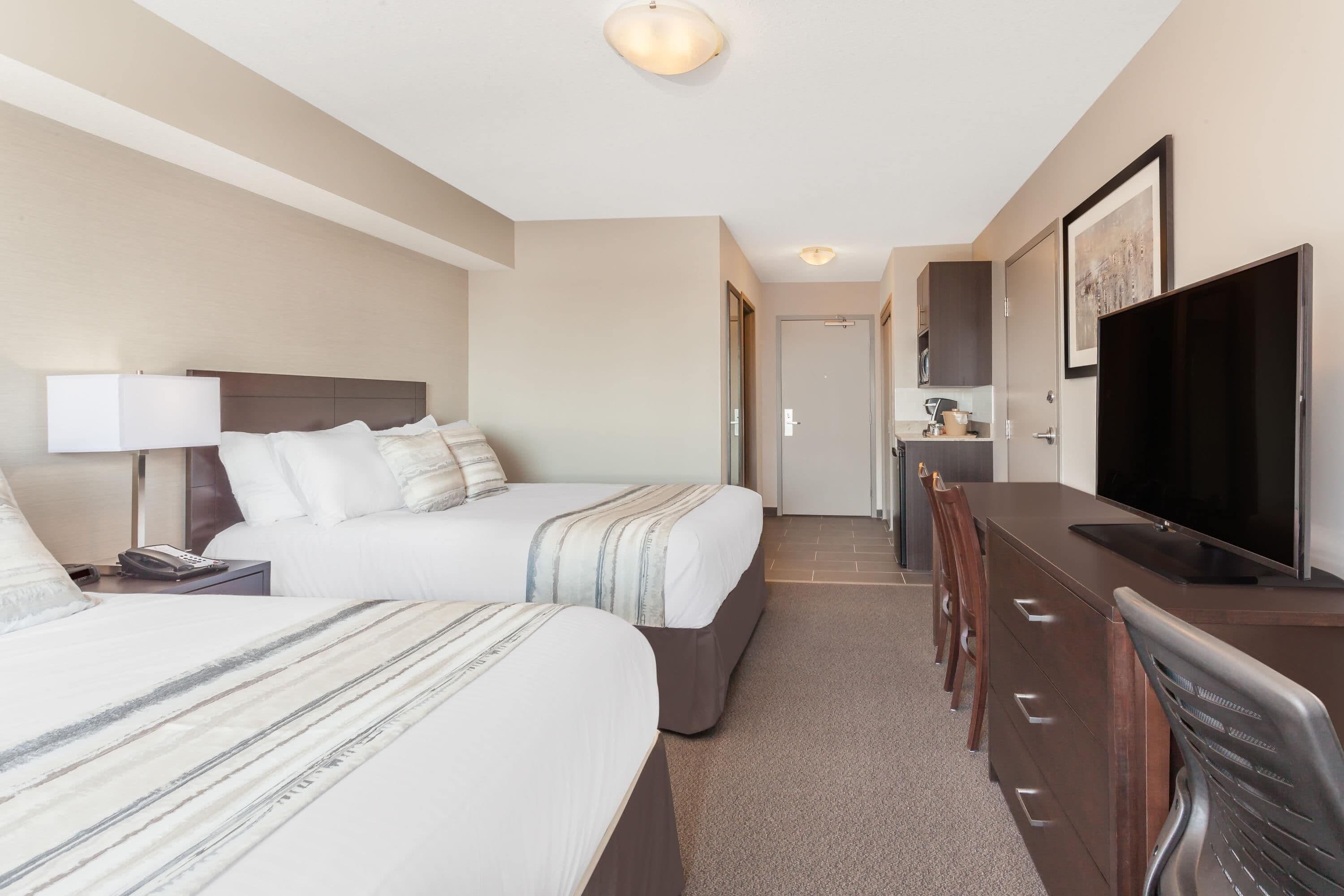 Room, 2 Queen Beds, Non Smoking | In-room safe, desk, laptop workspace, blackout drapes