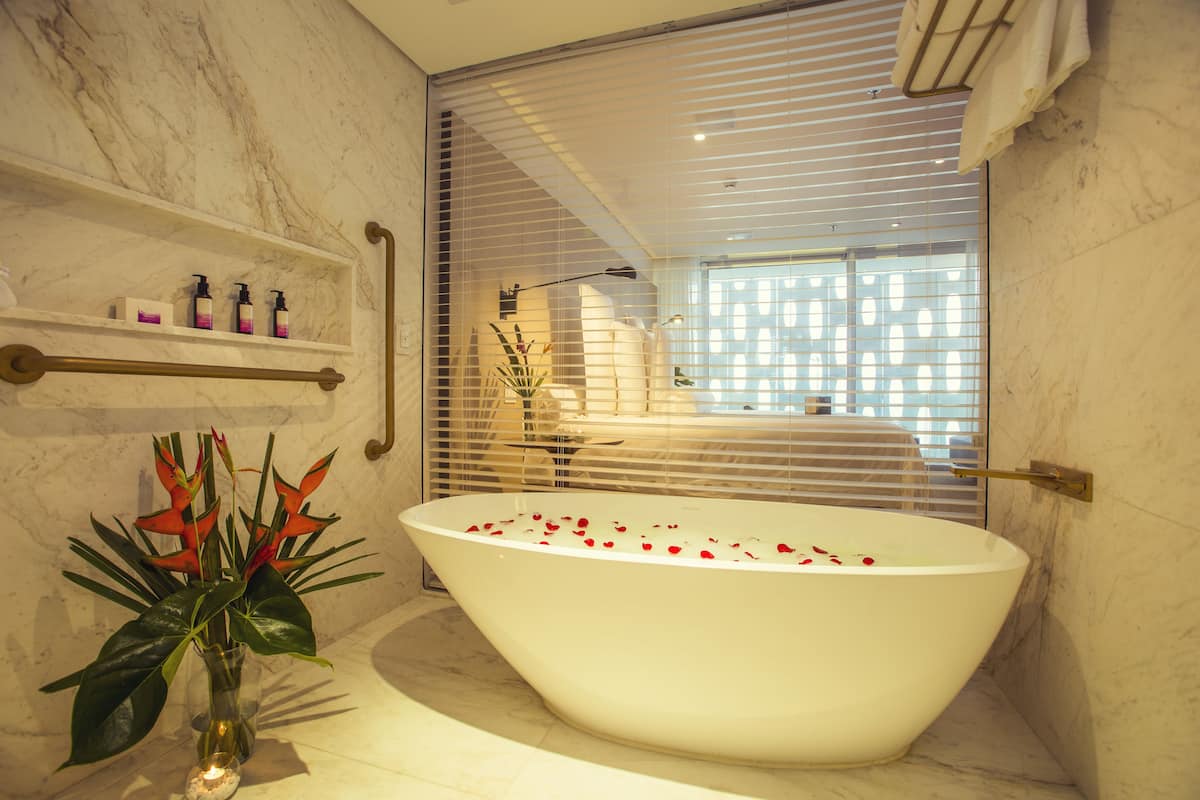 ocean deluxe room | bathroom | separate bathtub and shower, free toiletries, hair dryer, bathrobes