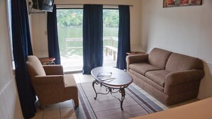 Deluxe Room, Multiple Bedrooms, Lake View | Living room | Flat-screen TV - Lela's Landing (Hot Springs)