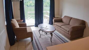 Deluxe Room, Multiple Bedrooms, Lake View | Living room | Flat-screen TV