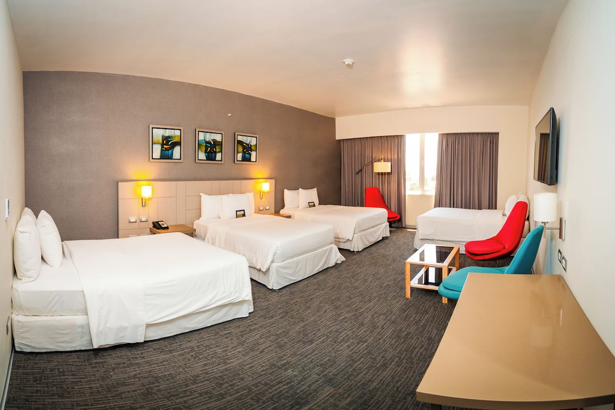 family room | 1 bedroom, minibar, in-room safe, desk