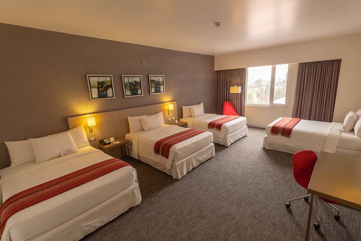 family room | 1 bedroom, minibar, in-room safe, desk