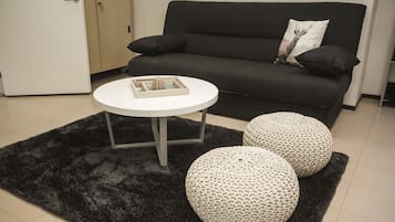 One-Bedroom Apartment - 4 - | Living area | Flat-screen TV