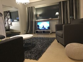 Three-Bedroom apartment, Ground Floor - 1 - | Living room | Flat-screen TV