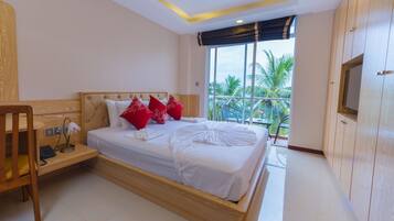 Deluxe Double Room, Sea Facing | Minibar, in-room safe, desk, iron/ironing board