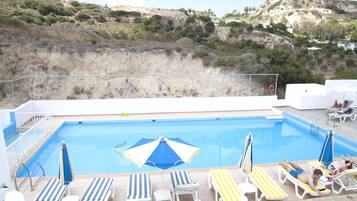 Outdoor pool, pool umbrellas, pool loungers