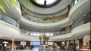A spacious lobby with a high ceiling, a central fountain, and a mural depicting a landscape. - Sonesta Star Goddess Nile cruise ship - 4 & 7 nights - From Luxor every Saturday (Luxor)