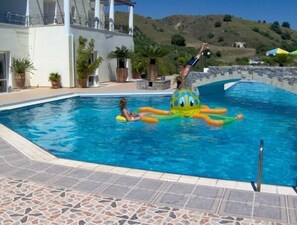 Outdoor pool, pool umbrellas, pool loungers