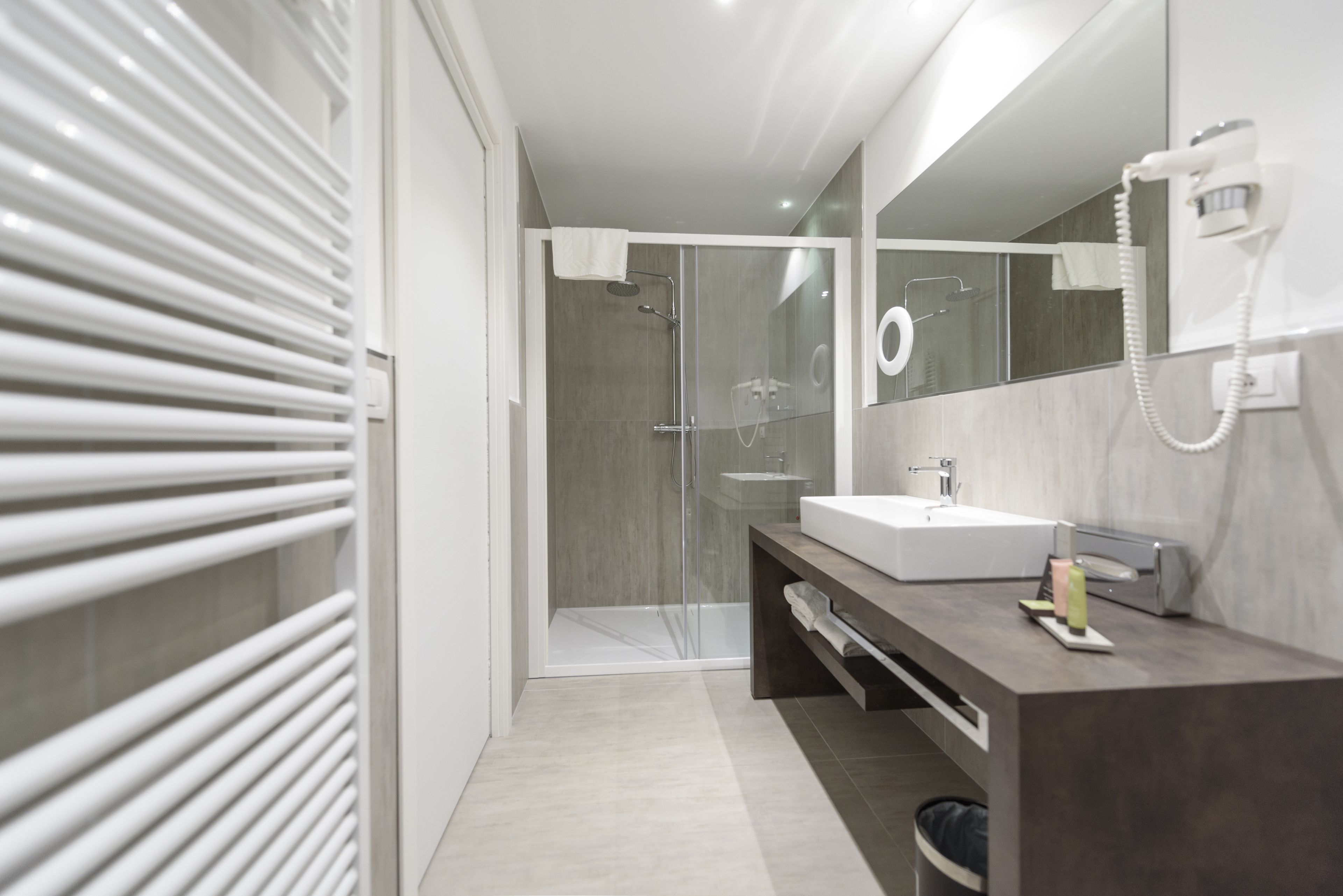 separate bathtub and shower, hair dryer, slippers, bidet