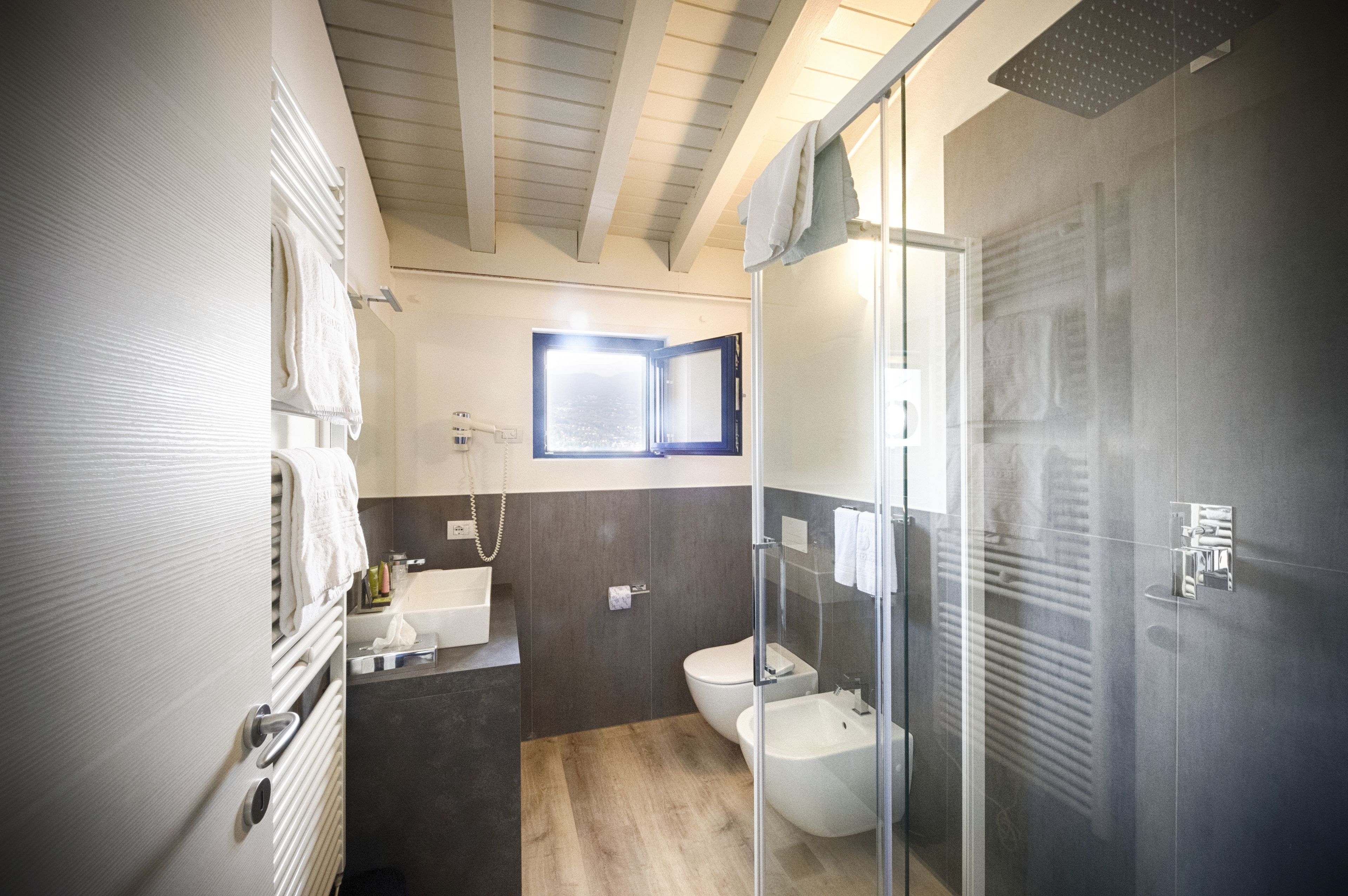 separate bathtub and shower, hair dryer, slippers, bidet