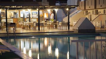 Lunch, dinner served; international cuisine, pool views