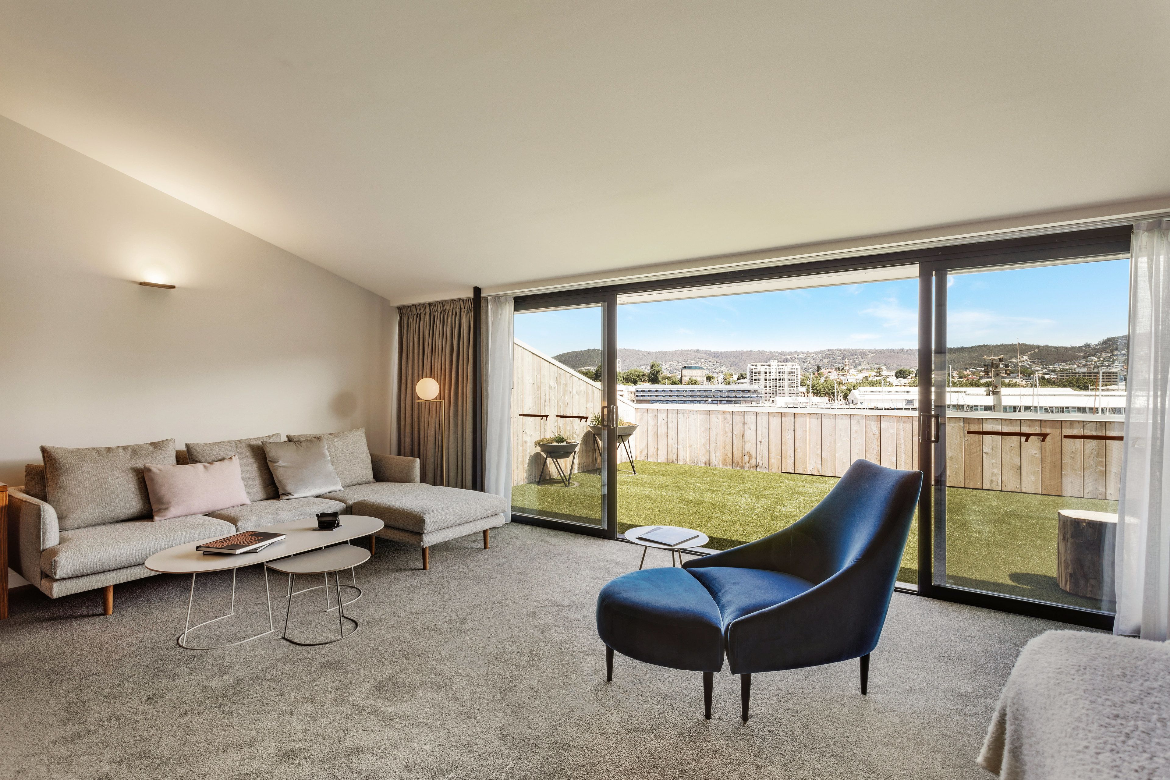 premium waterfront suite | living area | 55-inch flat-screen tv with cable channels, tv, ipad