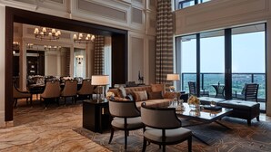 A spacious lobby with a high ceiling, a dining area, and a seating area with a view. - The Ritz-Carlton, Haikou (Haikou)