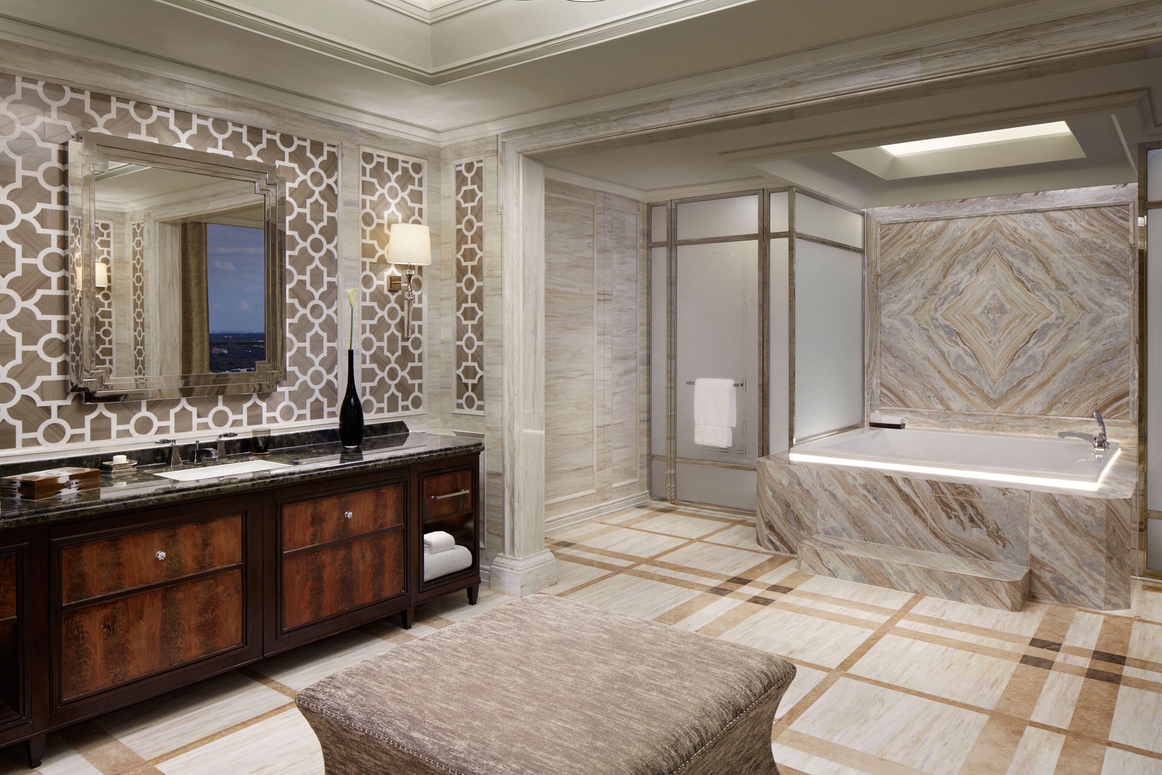 club suite, 1 king bed, golf view | bathroom | combined shower/bathtub, deep-soaking bathtub, designer toiletries
