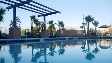 Outdoor pool, open 9:00 AM to 9:00 PM, pool loungers