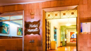 The entrance to Hotel Marcella with a sign above the door and a view into the lobby. - Hotel Marcella Clase Ejecutiva (Morelia)