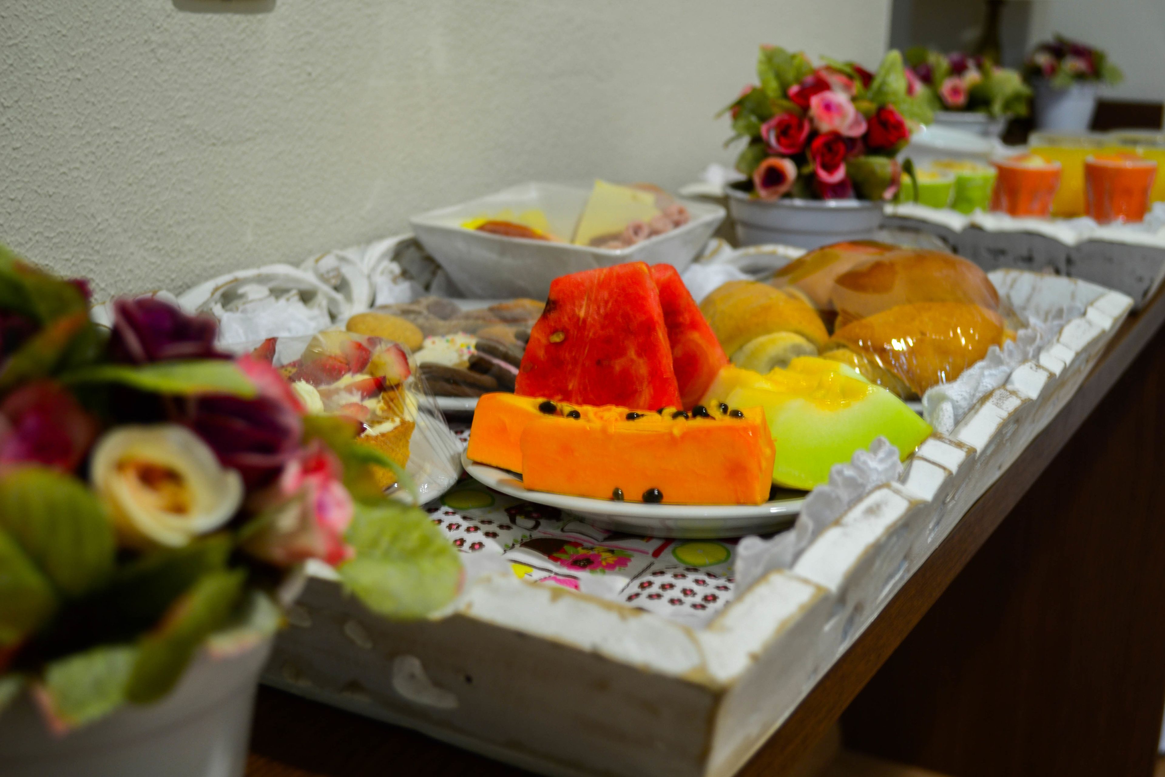 A buffet table with various fruits and vegetables.
