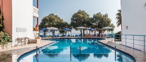 Outdoor pool, open 10:00 AM to 7:00 PM, pool umbrellas, pool loungers