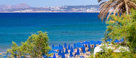 On the beach, sun loungers, beach umbrellas