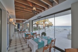 Breakfast, lunch, dinner served; international cuisine, beach views 