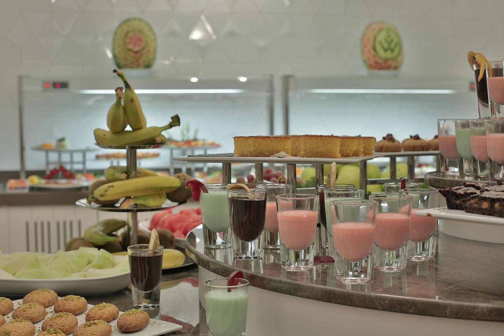A buffet with various food items and drinks.