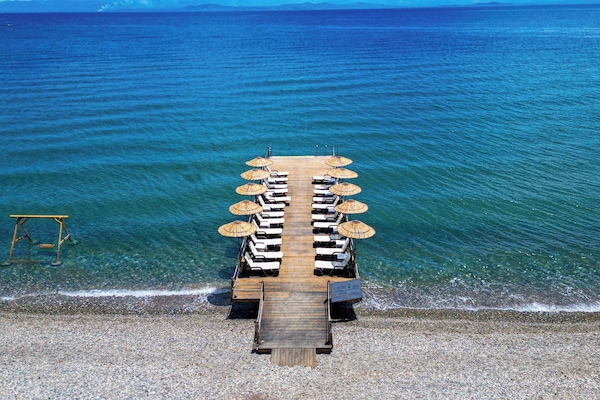 On the beach, free beach cabanas, sun-loungers, beach umbrellas
