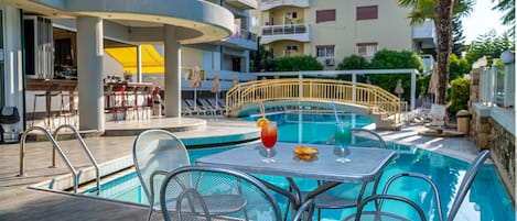 Seasonal outdoor pool, pool umbrellas, pool loungers