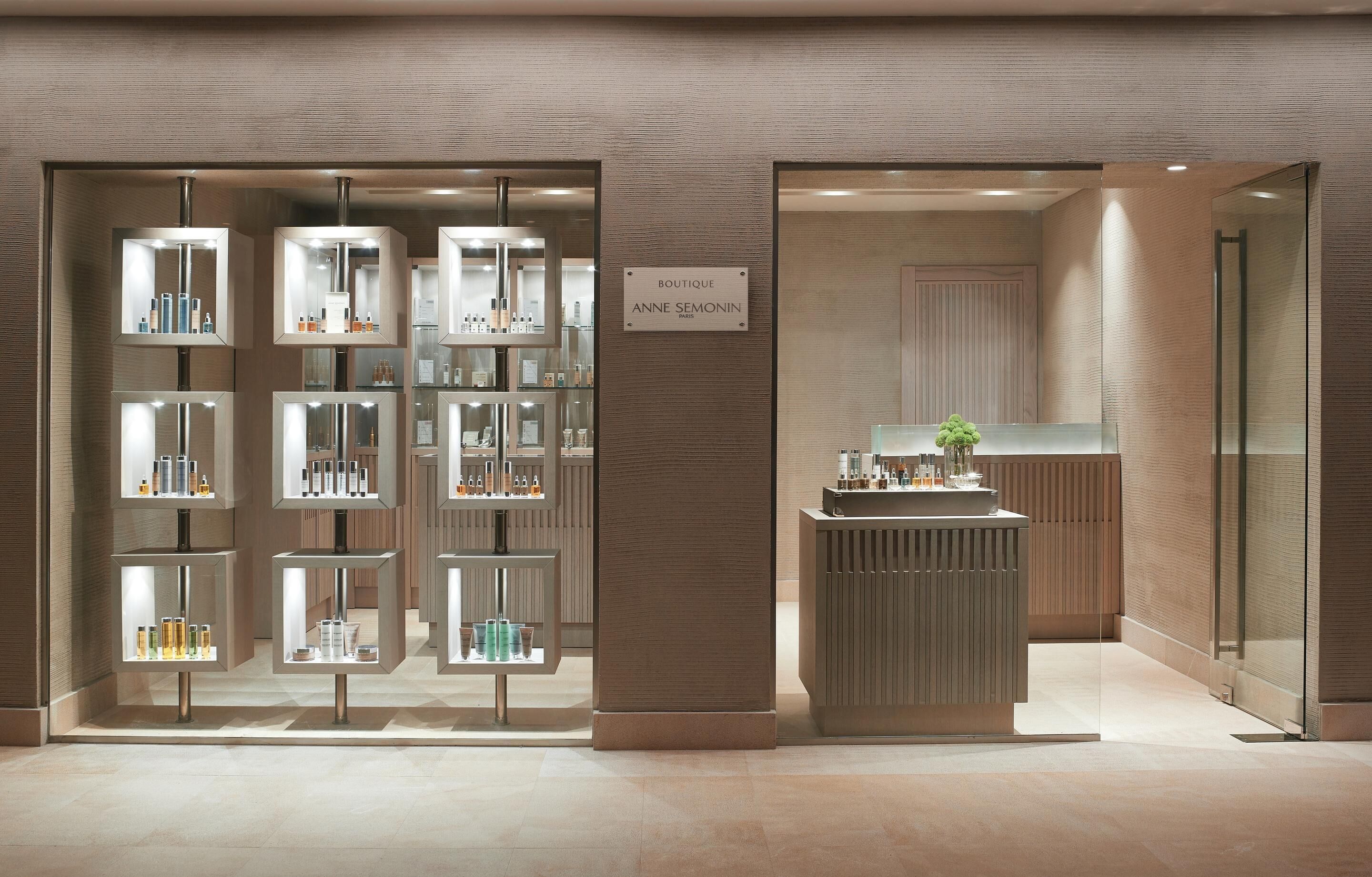 A boutique with glass display cases and a reception desk.