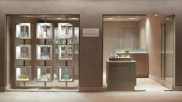 A boutique with glass display cases and a reception desk.