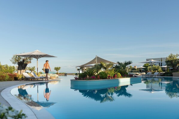 Indoor pool, outdoor pool, pool umbrellas, pool loungers