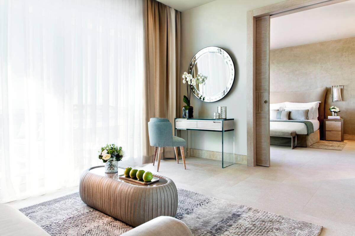 One Bedroom Suite Grand Balcony Pool View | Minibar, in-room safe, desk, iron/ironing board