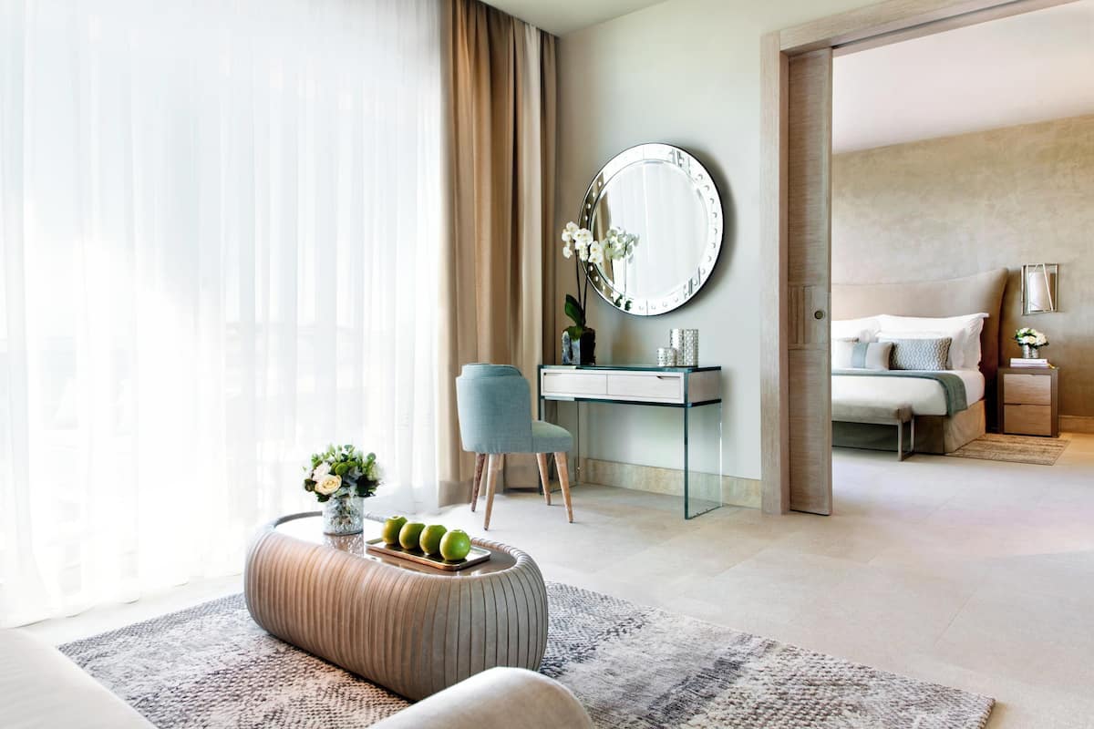 One Bedroom Suite Grand Balcony Pool View | Minibar, in-room safe, desk, iron/ironing board