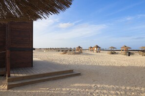 Beach nearby, white sand, sun-loungers, beach umbrellas