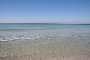 A beach with clear shallow waters and a sandy shore. - Cape Cottage (Port St. Joe)