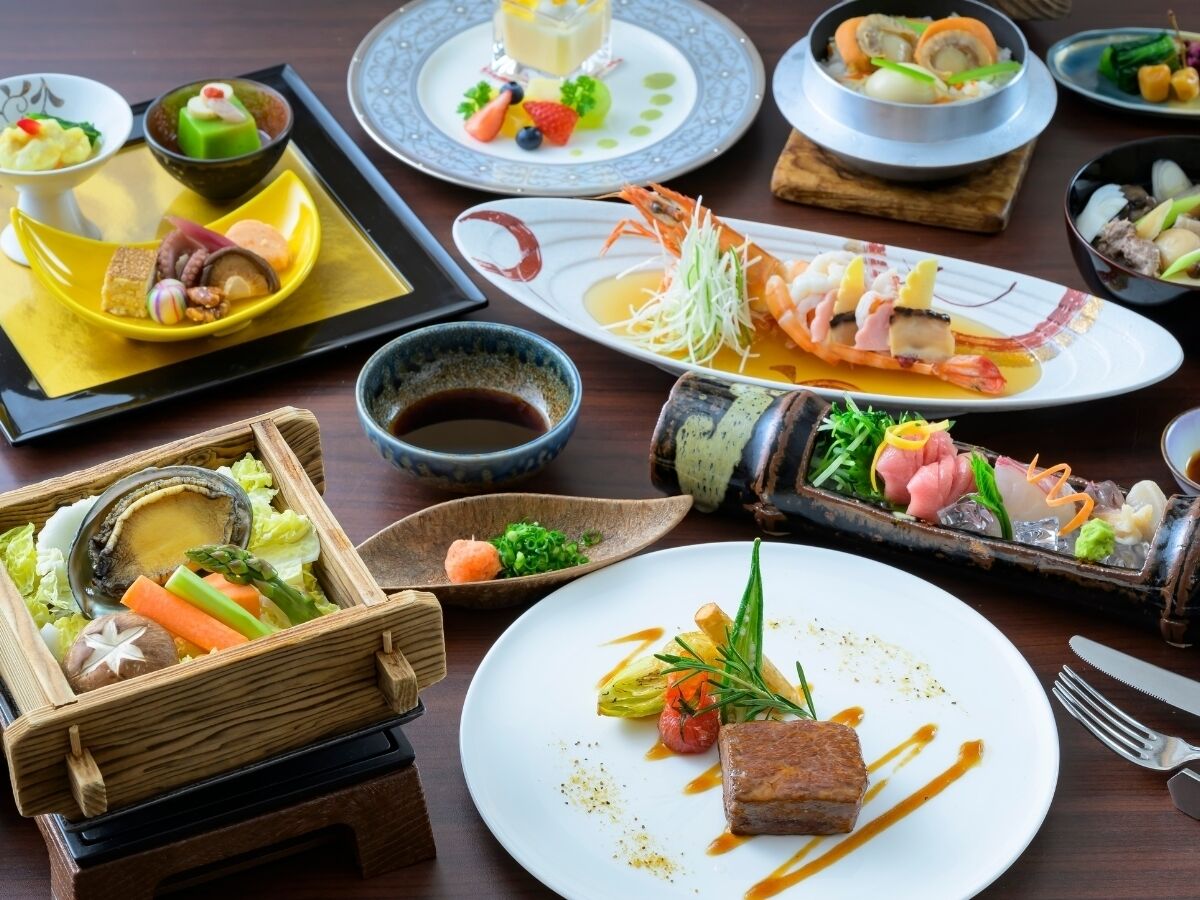 A variety of dishes on a wooden table, including seafood, vegetables, and a dessert.