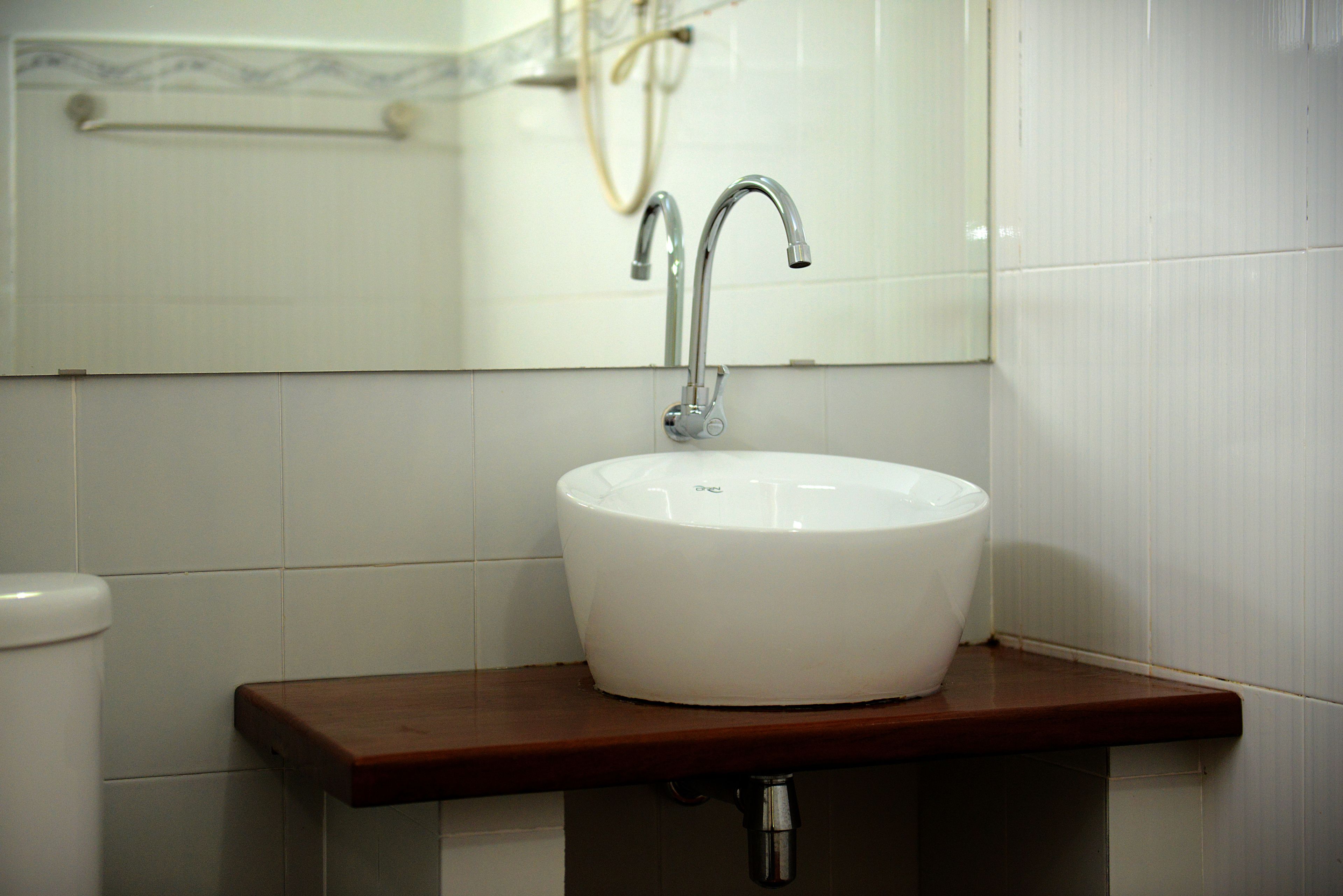 double room, river view | bathroom | shower, free toiletries, slippers, towels