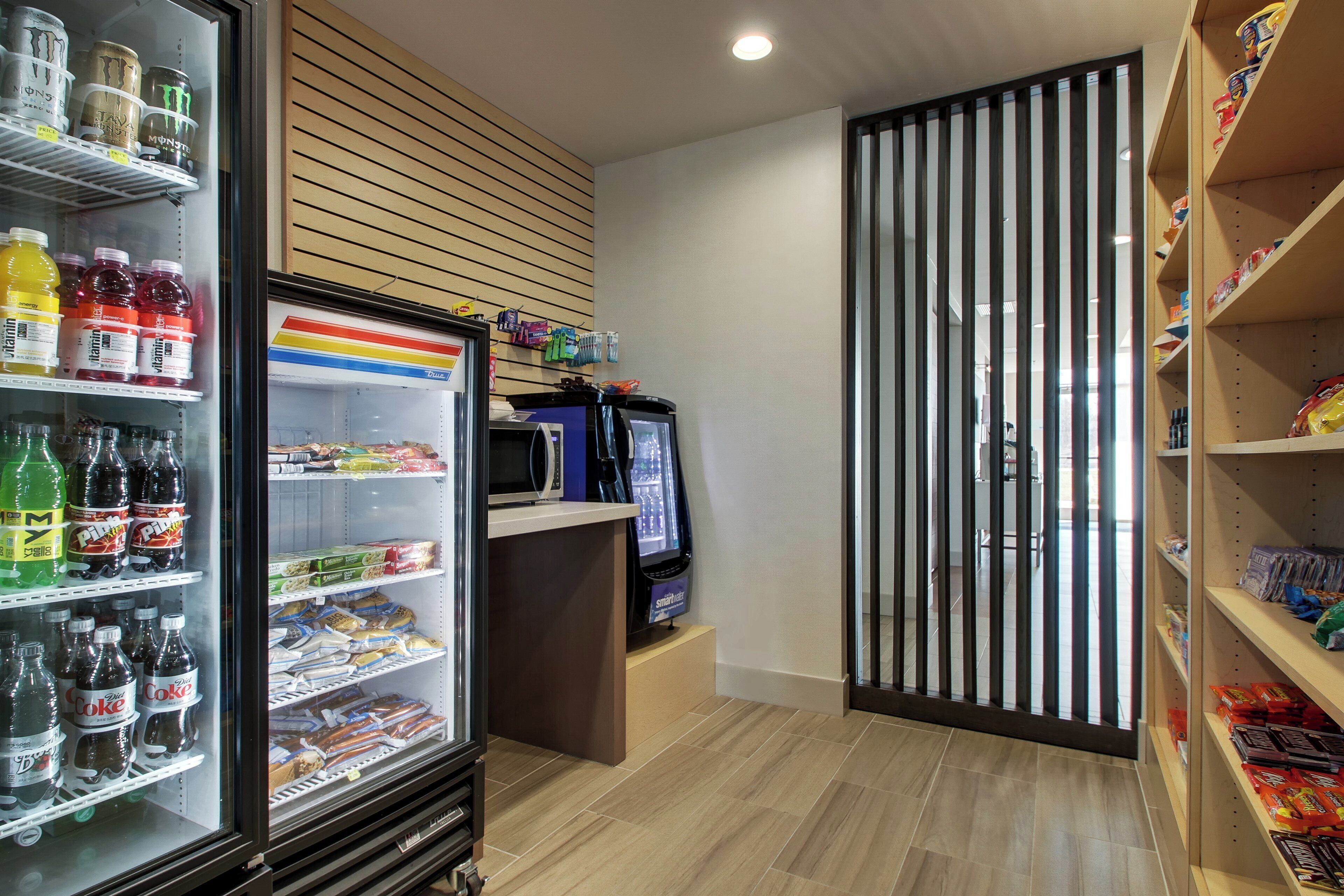 A vending machine area with various drinks and snacks.