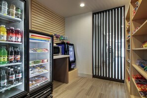 A vending machine area with various drinks and snacks. - Holiday Inn Express & Suites Mount Vernon by IHG (Mount Vernon)